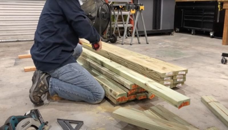 cutting the PT lumber pieces