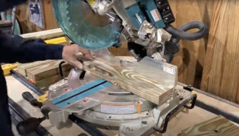 miter saw cutting vertical boards