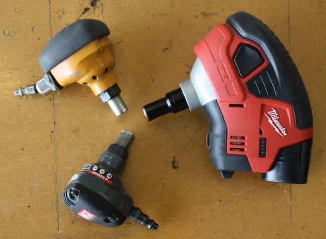 Milwaukee 2458-21 M12 Cordless Palm Nailer next to other brands