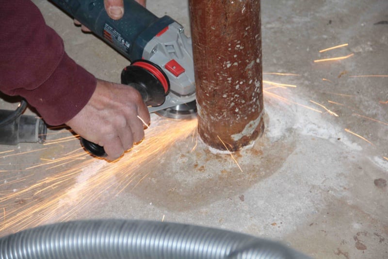 Cutting off Lally columns angle grinder