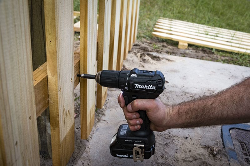 fastening a section of fence to a 4x4 post