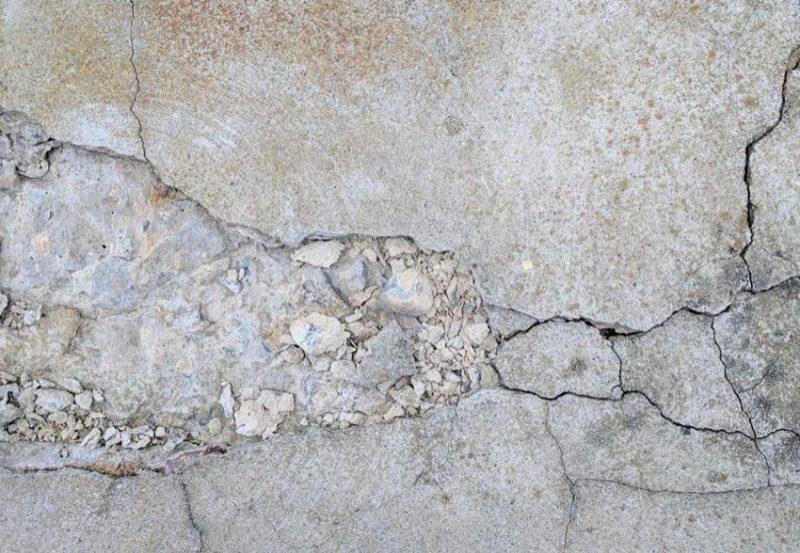 Repair any spalling or scaling concrete