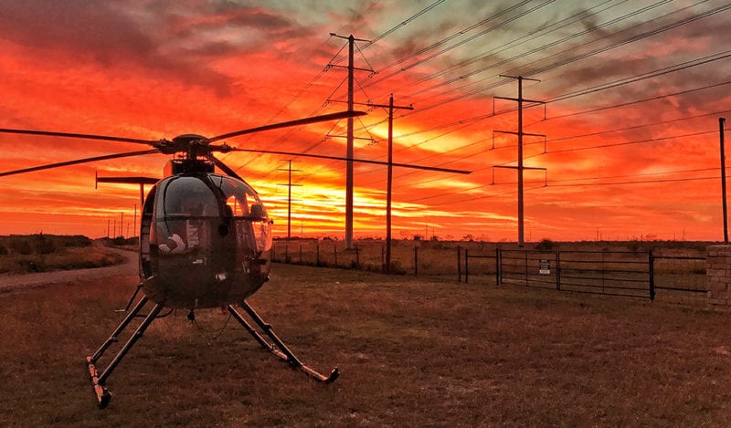 helicopter linemen fly to their location for quick repairs and easier access to remote locations.