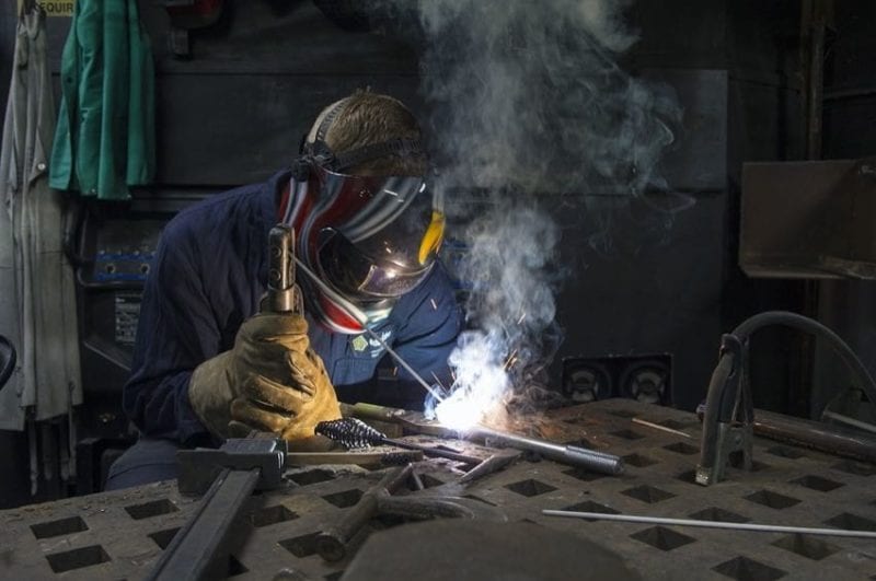 stick welding with helmet for eye protection