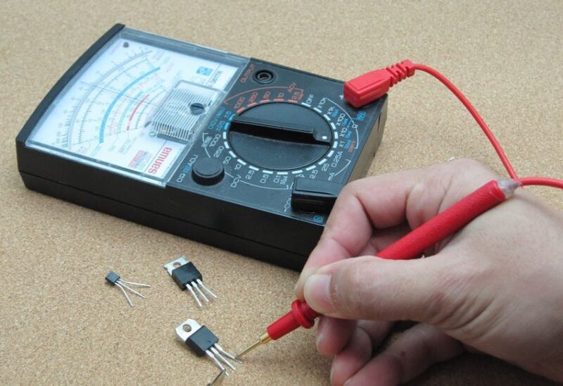 analog multimeter or voltage tester measuring continuity
