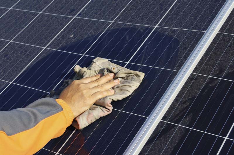 use a squeegee or soft rag to clean solar panels