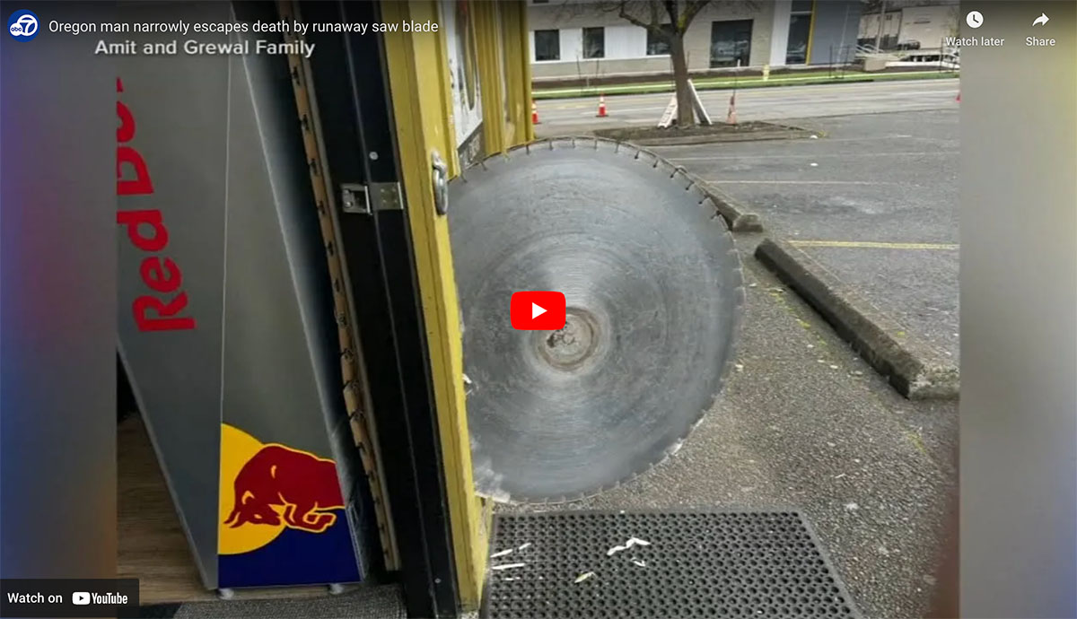 Giant Saw Blade Barely Misses Guy Walking into a Store (Video)